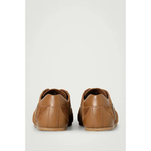 6526b682e719a624d41b5e41_cos-minimal-suede-t-rainers_1763413384361.png