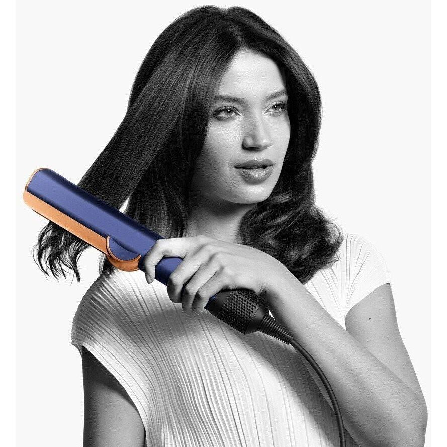 6526b682e719a624d41b5e41_dyson-airstrait-night-blue-copper_1793286209907.jpg