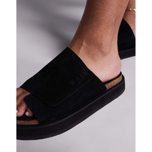 6526b682e719a624d41b5e41_walk-london-black-barca-velcnro-mule_1764535054631.png